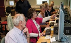 Older people working on computers