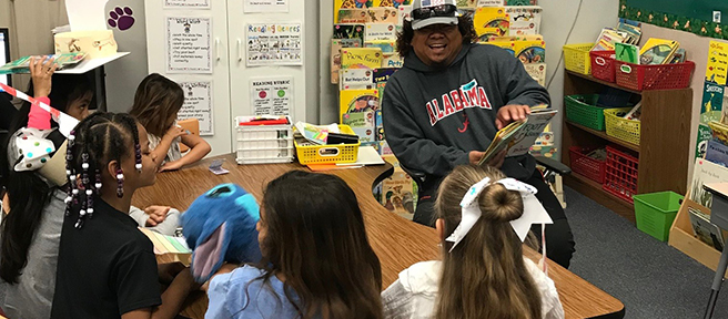 Parent reads with students