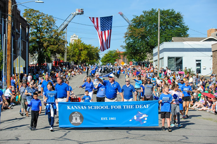 KSD staff, students and parents are participating to march and to wave down the street.