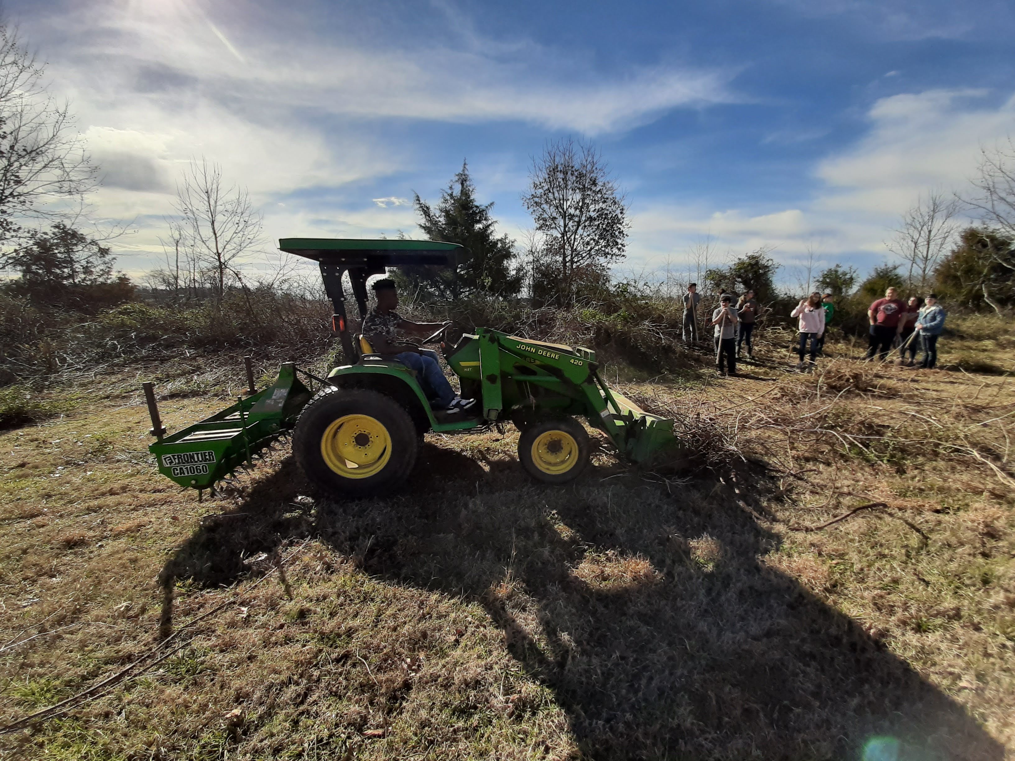 Ag student driving the front loader Ag student driving the front loader