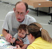 Staff working with young child