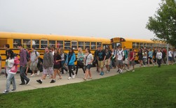 Children walking up to their busses