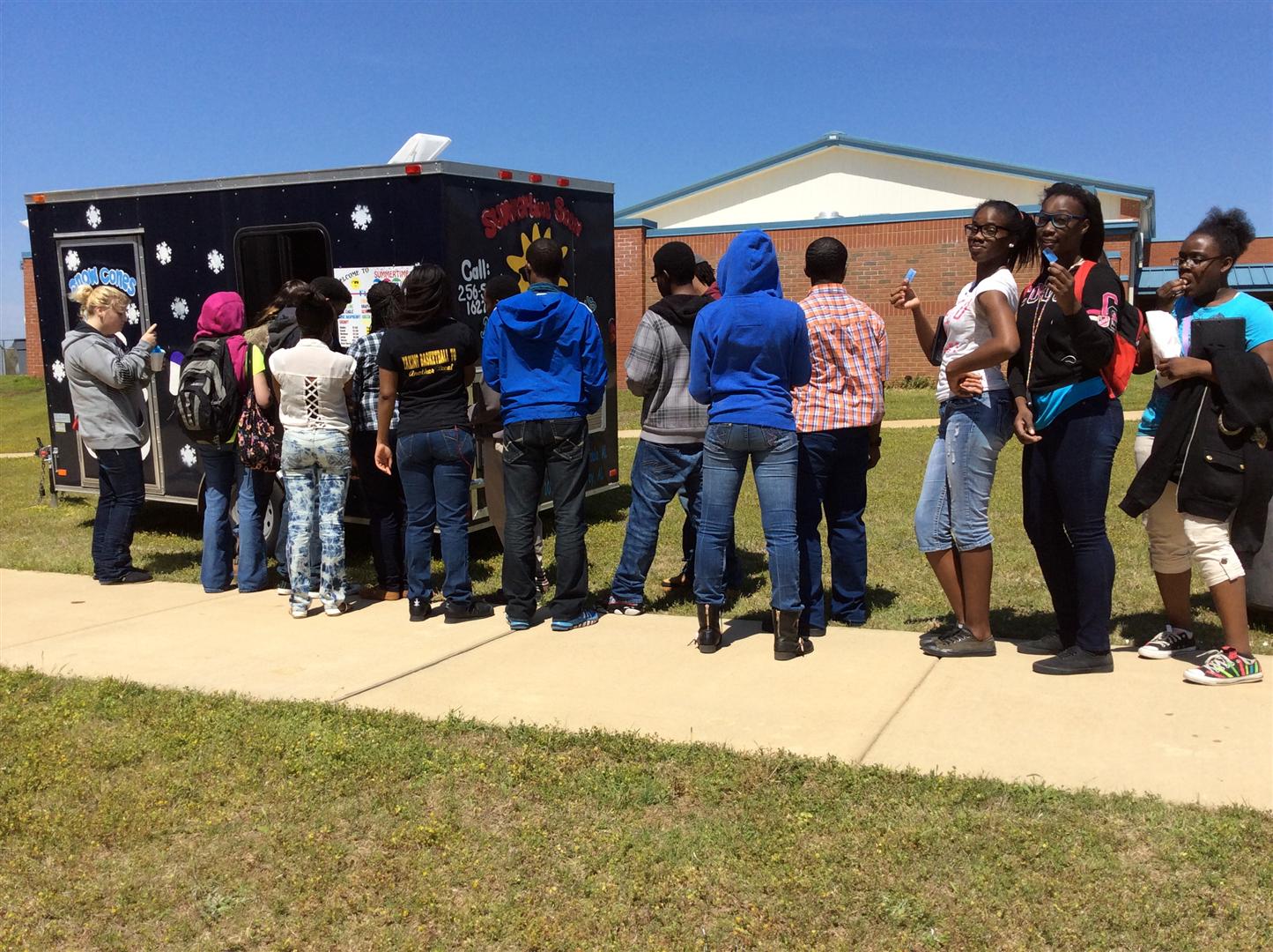Students wait in line for a snow cone