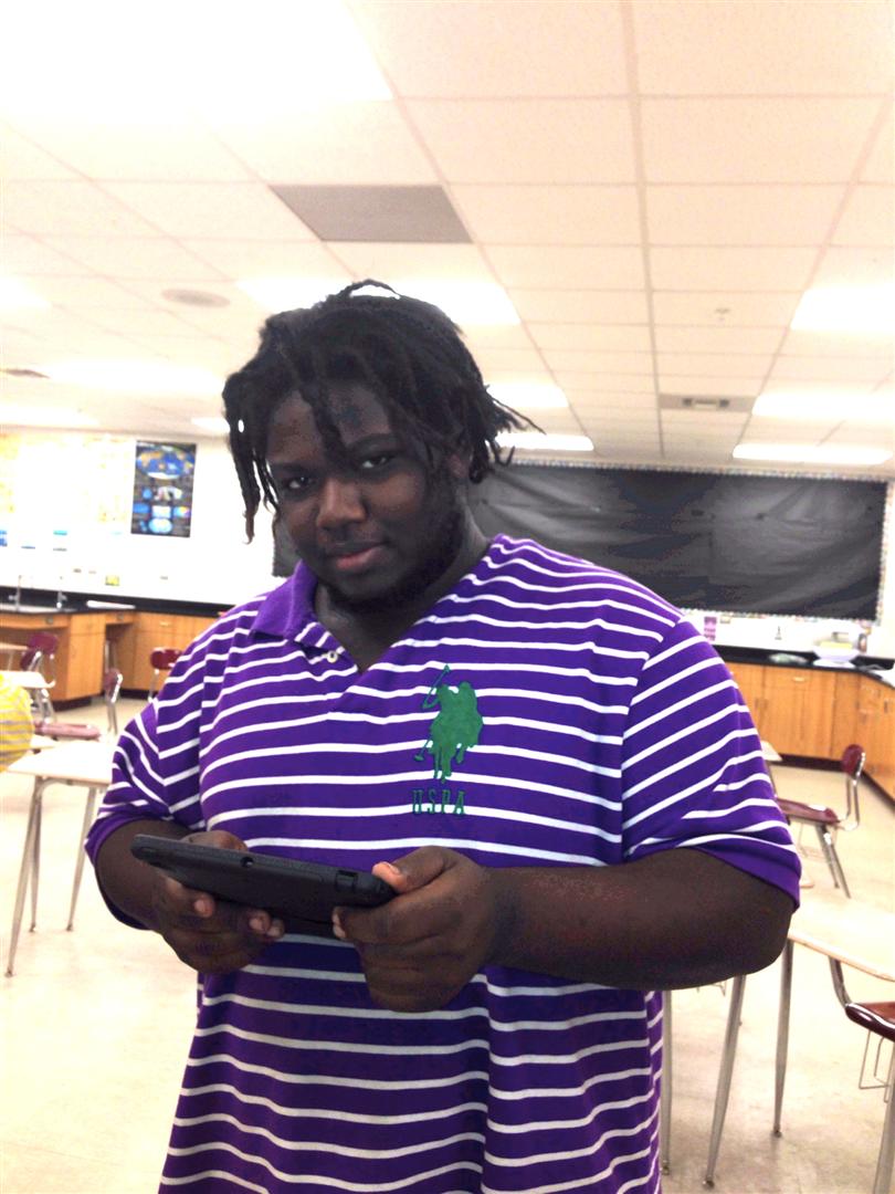 A QCHS student enjoying the use of his iPad