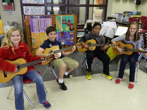 Greystone students practice guitar