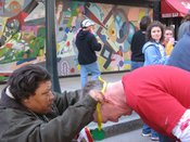 Diane giving a handmade medal to a runner.